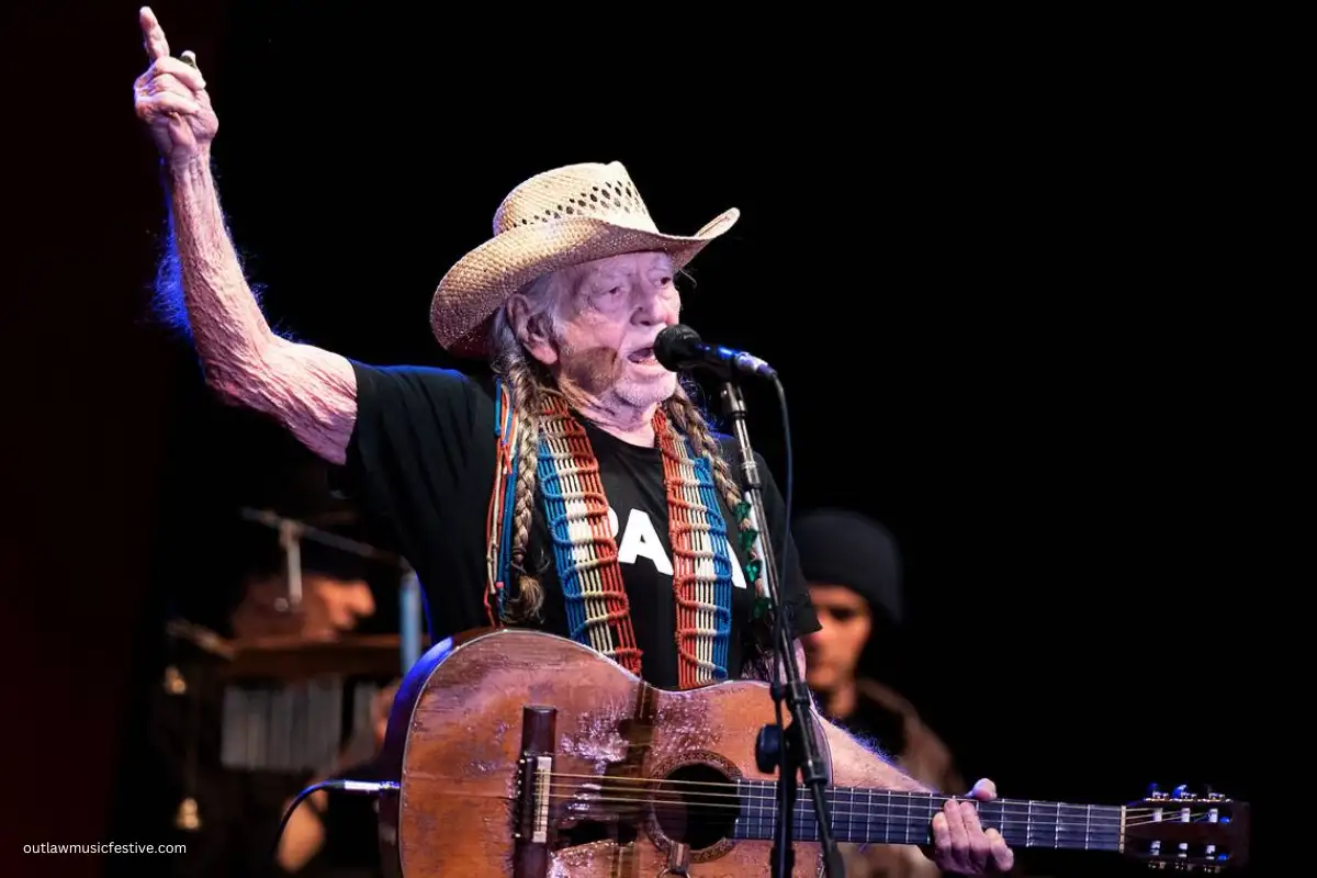 Willie Nelson performing at the Outlaw Music Festival