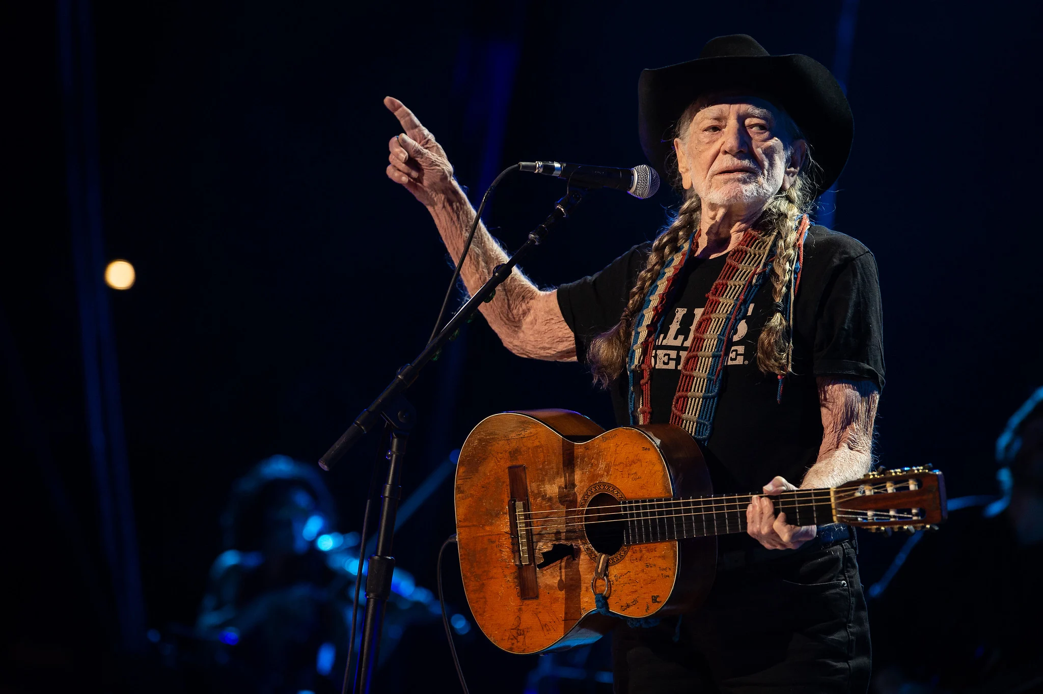 Willie Nelson performing live at the Outlaw Music Festival 2026 tour